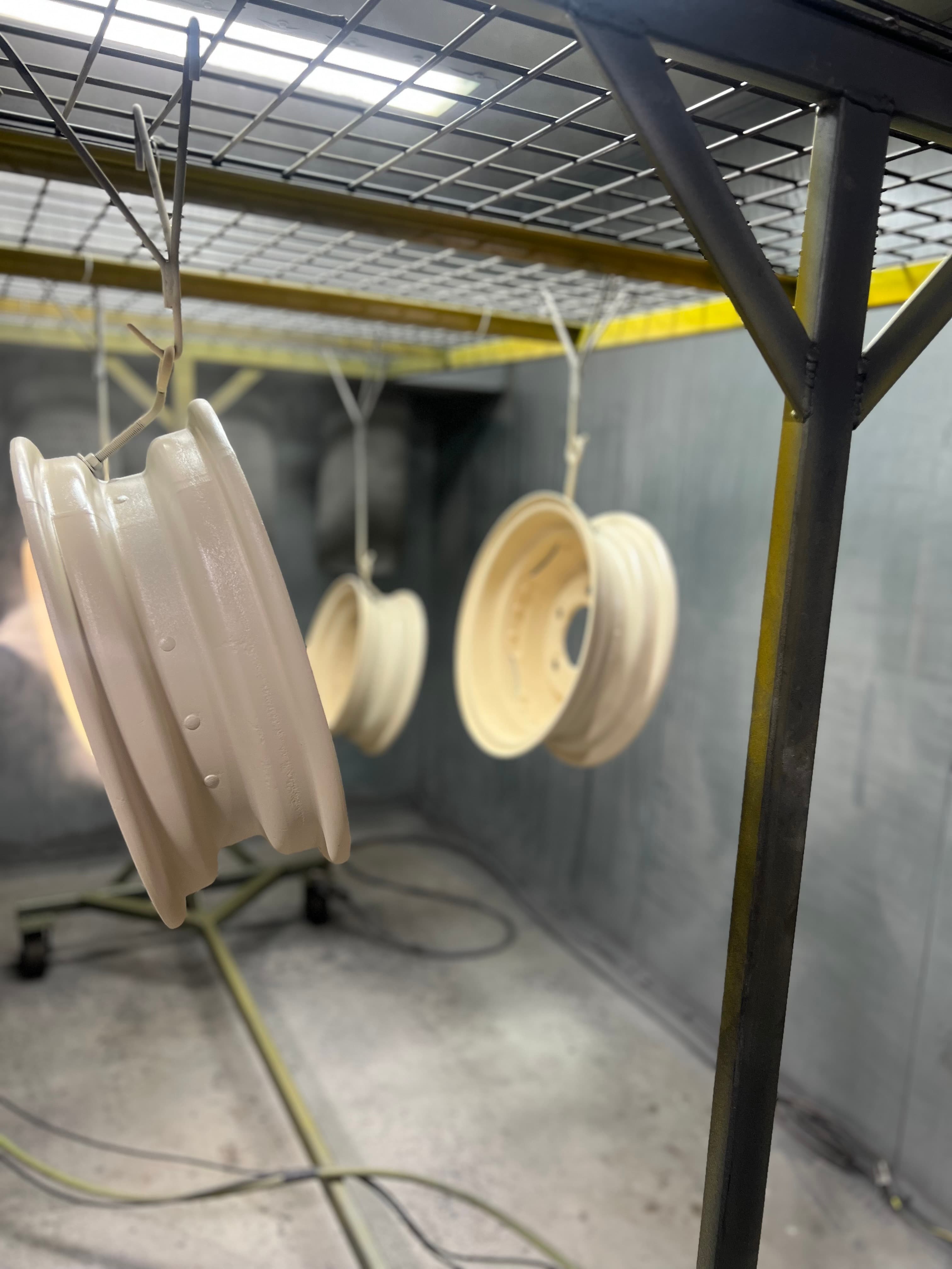 Wheels hanging at Paragon Powder Coating & Wheel Repair